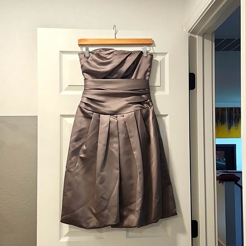 Vera Wang stone colored bridesmaid dress with bubble hem, bow in back.